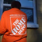 Home Depot volunteer working on a Preservation and Repair Project