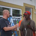 Habitat staff giving gift to homeowner